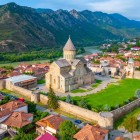 Mtskheta, the ancient capital of Georgia and an important religious center, is home to the majestic Svetitskhoveli Cathedral, a UNESCO site set between rivers and the Caucasus mountains.