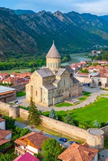 Mtskheta, the ancient capital of Georgia and an important religious center, is home to the majestic Svetitskhoveli Cathedral, a UNESCO site set between rivers and the Caucasus mountains.