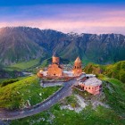 The Gergeti Trinity Church, dating back to the 14th century, stands at 2,170 m at the foot of Mount Kazbek. Built in stone in medieval Georgian style, it is an iconic symbol of the Caucasus.