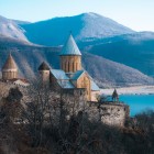The Ananuri Fortress, dating back to the 17th century, overlooks Lake Zhinvali. Once the stronghold of the Dukes of Aragvi, it features defensive towers and richly decorated Georgian churches.