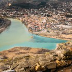 Aerial view of the ancient city in the valley where the Mtkvari (Kura) and Aragvi rivers meet, among gentle plateaus. The majestic Svetitskhoveli Cathedral stands out in the city of Mtskheta, Georgia.