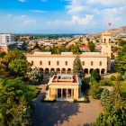 Aerial view of the Stalin Museum in Gori, birthplace of the Soviet leader, featuring the monumental building surrounded by gardens and the urban landscape of central Georgia.