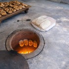 Preparation of traditional Armenian lavash baked in a tonir oven: an ancient cooking technique and one of the most authentic experiences of Armenian culinary culture.