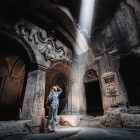 Interior of Geghard Monastery in Armenia, a UNESCO rock-hewn complex with striking light effects: one of the most fascinating spiritual and historical sites in the Caucasus.