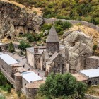 Geghard Monastery in Armenia, a UNESCO World Heritage site carved into rock: a remarkable medieval complex set among mountains, symbol of Armenian spirituality.