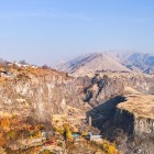 Panoramic view of the Garni Gorge in Armenia, with cliffside villages and stunning mountains: authentic landscapes and wild nature in the heart of the Caucasus.