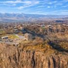Aerial view of the Garni Temple in Armenia, perched above the Azat Gorge, surrounded by mountains and villages: one of the most iconic and scenic historical sites in the Caucasus.