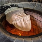 Lavash is a thin, fragrant Armenian bread, made with ancient techniques and baked in underground tonir ovens, giving it a unique and authentic flavor.