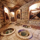 Traditional cellar in Armenia’s Ararat region, with underground vessels where wine slowly matures among stone and brick, following ancient local techniques.
