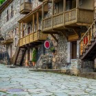 Historic center of Dilijan, Armenia: pedestrian street with medieval stone houses and wooden balconies, rich in tradition, craftsmanship and authentic charm.