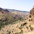 Scenic road through the Vayots Dzor canyon, among rocky and arid landscapes, leading to Noravank Monastery with breathtaking views of authentic Armenia.