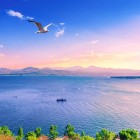 Lake Sevan, one of the largest alpine lakes in the world, enchants with crystal-clear waters and breathtaking views, surrounded by mountains in the heart of Armenia.