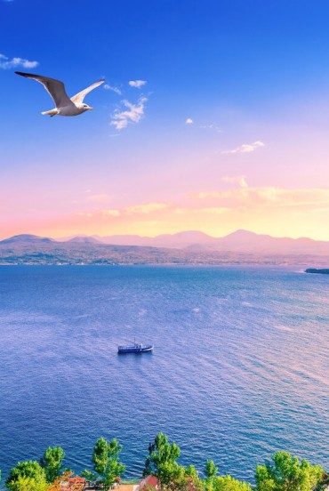 Lake Sevan, one of the largest alpine lakes in the world, enchants with crystal-clear waters and breathtaking views, surrounded by mountains in the heart of Armenia.