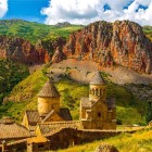 Noravank Monastery, Armenia: set between red mountains and green hills, this medieval complex in Vayots Dzor canyon offers breathtaking views and unique charm.
