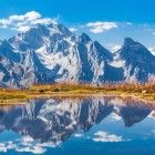 Alpine lake near Mestia reflecting the Caucasus peaks. A stunning landscape with crystal-clear waters, majestic mountains and pristine nature.