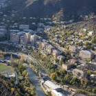 View of the city of Alaverdi, Armenia, with buildings stretching along the river between deep gorges and mountain landscapes, in a striking natural setting.