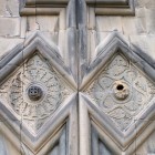 Carved details of the façade of Akhtala Monastery in Armenia, with refined stone decorative motifs showcasing medieval Caucasian craftsmanship.