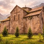 Akhtala Monastery in Armenia, set among mountains and nature, captivates with its medieval stone architecture and a suggestive atmosphere rich in history and spirituality.