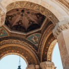 Decorated vaults of the Echmiadzin Cathedral in Armenia, with detailed frescoes and bas-reliefs, symbol of sacred art and Armenian spirituality.