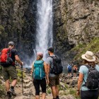 The Gveleti waterfall, a stunning natural attraction in the picturesque village of the same name in the Caucasus, about 30 meters high, plunges into a शांत natural pool below.