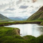 Small alpine lake in Truso Valley, nestled among high-altitude meadows and Caucasus mountains in one of the trek’s most peaceful settings.