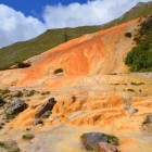 The mineral springs of Gudauri color the hillside with orange hues and natural deposits, creating one of the most distinctive geothermal landscapes in the Georgian Caucasus.