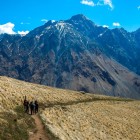 Hikers along the Sabertse Pass trail, immersed in Kazbegi’s vast high-altitude landscapes with spectacular views over the Caucasus mountains.