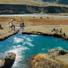 Natural thermal spring in Truso Valley, one of the trek’s most distinctive highlights amid mineral waters and open Caucasus landscapes.