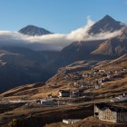 Panoramic view of Gudauri at sunset, with the village nestled among the Greater Caucasus mountains in one of Georgia’s most spectacular settings.