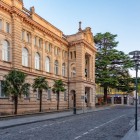 Historic building on Empty Street in Kutaisi, featuring a classical facade, elegant arches and refined details. A harmonious example of local urban architecture.