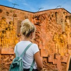 Decorated entrance of the local bazaar in the heart of Kutaisi’s old town, with bas-reliefs telling scenes of daily life and traditions in a historic setting.