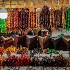 Dried fruits and traditional sweets hanging in the stalls of Kutaisi’s bazaar, with vibrant colors and rich aromas in an authentic, traditional atmosphere.