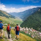 A gentle descent on foot toward Iprali through meadows and mountain trails. Svan towers rise among the houses, while the valley slowly opens between forests and silence