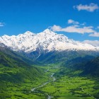 Bright valley at the foot of Tetnuldi, with its twin crystalline peaks. The Oish, Adishi and Nageb glaciers descend toward Mestia, nearby in Svaneti.