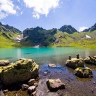 Namkvami glacial lake in Svaneti, Georgia, at 2,500 m below Mount Shkhara. Turquoise waters, glaciers and alpine silence in the wild landscapes of the Caucasus.