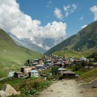 Ushguli, among the highest villages in Europe, lies in Svaneti at the foot of Shkhara. Stone towers, green valleys and glaciers shape the landscape.