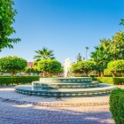 Garden in the Medina of Marrakech, with fountains, palm trees and green corners offering tranquility in the heart of Morocco.