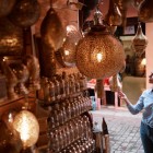 Along the streets of the Medina in Marrakech, shops and lanterns create warm and authentic atmospheres in the heart of Morocco.
