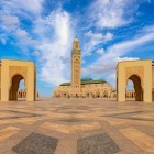 The Hassan II Mosque dominates Casablanca with its minaret overlooking the ocean. The vast marble square enhances the sense of space and harmony.