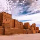 Close-up of Kasbah Taourirt, with red-earth walls, towers and details that reflect the Berber architecture of southern Morocco.