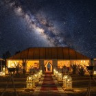 Night sky and the Milky Way above the Merzouga desert camp create an intimate and evocative atmosphere in the heart of the Sahara.
