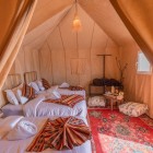 The bedroom of a luxury camp in the desert of Merzouga, one of the main gateways to the Sahara in the province of Errachidia, Morocco.
