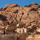 Village at the foot of the Anti-Atlas Mountains near Tafraout, among traditional houses, palm trees and spectacular pink granite formations.