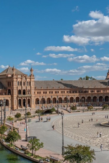 In the heart of Seville, Plaza de España captivates with elegant bridges, scenic canals and majestic architecture showcasing the authentic spirit of Andalusia.