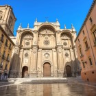 The magnificent main façade of Granada Cathedral rises in the heart of the city, where elegant Renaissance architecture reflects the rich history and artistic heritage of Andalusia.