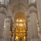 The majestic naves of Granada Cathedral lead to the magnificent golden altar, where Renaissance art, spirituality and centuries of history blend in perfect harmony.