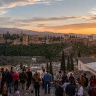 From the Mirador de San Nicolás, Granada's most iconic panorama unfolds, with the Alhambra glowing at sunset and the Sierra Nevada in the background. An unforgettable view.