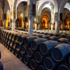 Inside the historic bodegas of Jerez de la Frontera, oak barrels preserve the renowned Sherry wine, aged through the traditional Solera system passed down for generations.