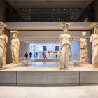 The famous Caryatids welcome visitors to the New Acropolis Museum, preserving the legacy of ancient Athens and showcasing the timeless elegance of Greek classical art.