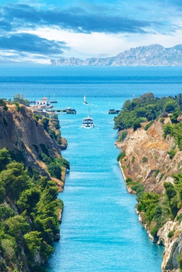 The Corinth Canal links the Ionian Sea with the Aegean through a spectacular rock-cut gorge. An engineering masterpiece that continues to amaze visitors today.